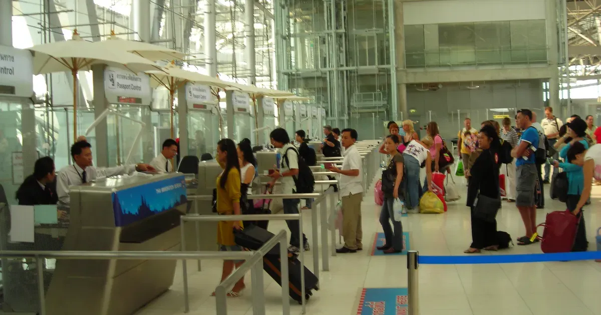Travellers queuing at the foreign passport immigration counters in the arrivals hall of Suvarnabhumi Airport